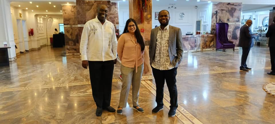 A photo taken at the conference involving Edephonce, Tanu, and Abdullahi