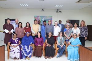 photo consisting of participants present at the symposium